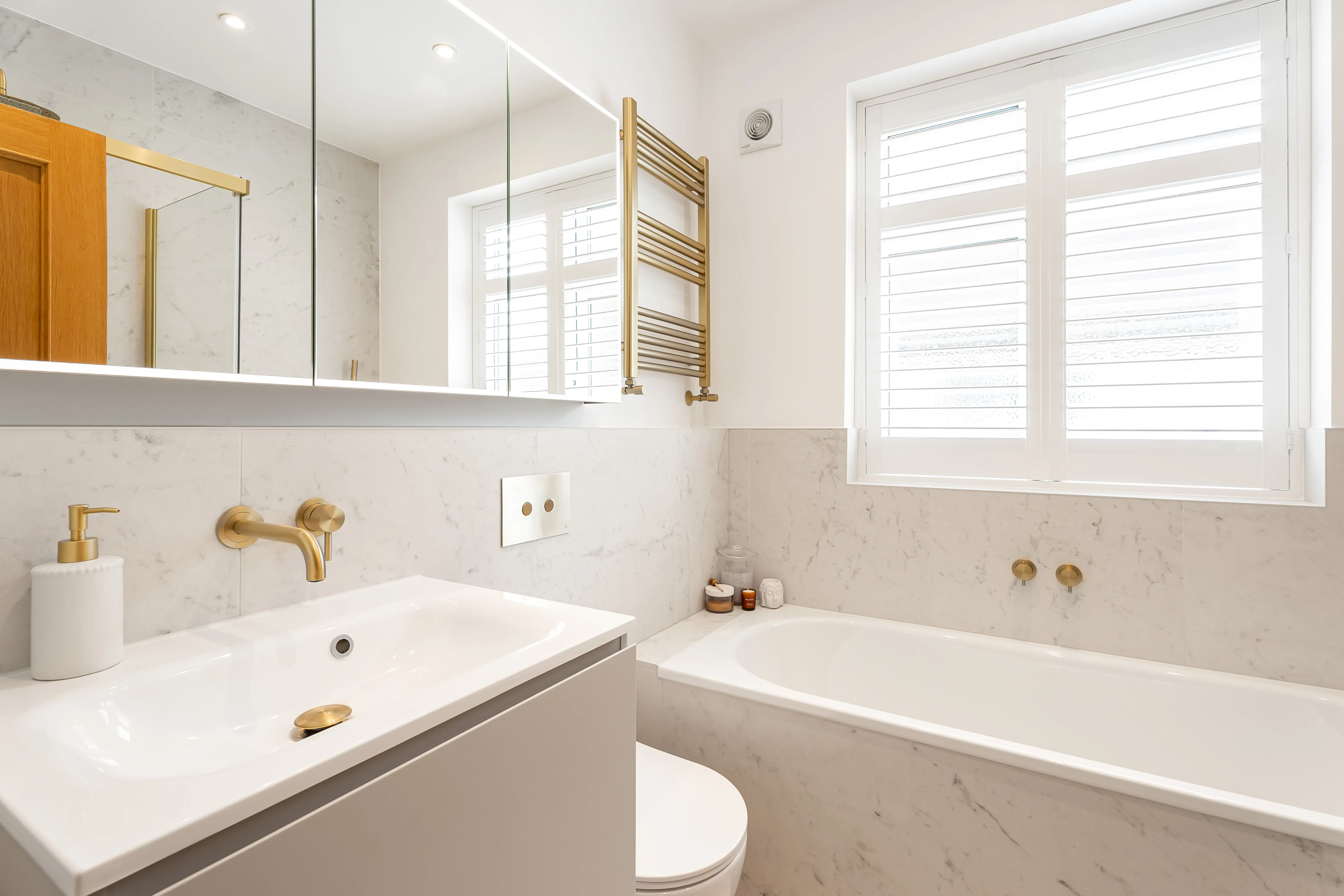 Marble Walls and Honeyed Hardware
