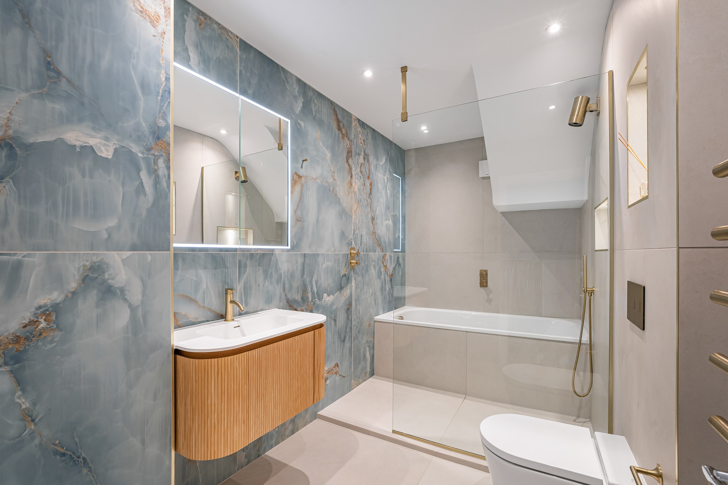 The Ocean Onyx & Fluted Oak Bathroom