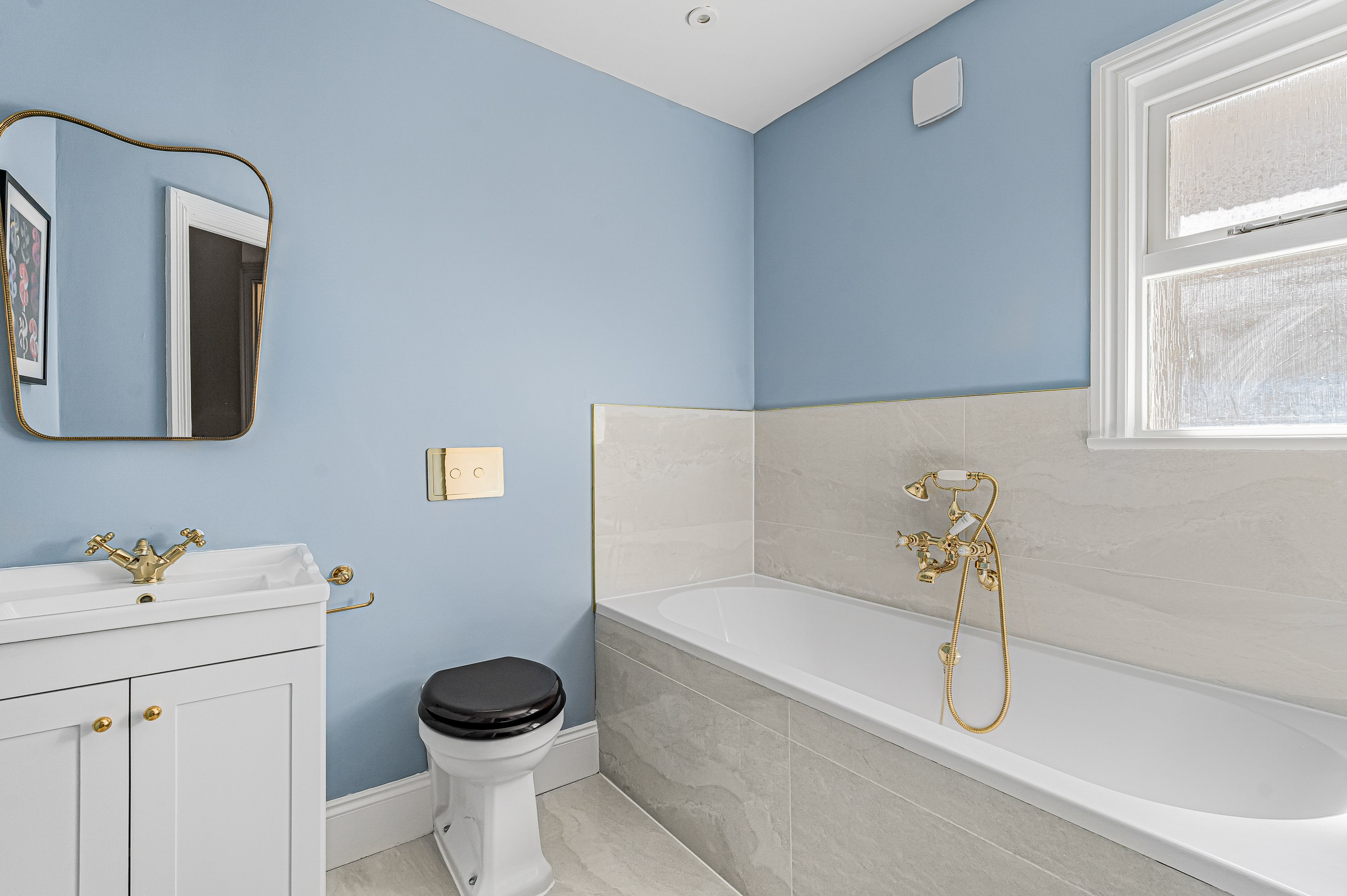 The Powder Blue & Gold Guest Bathroom